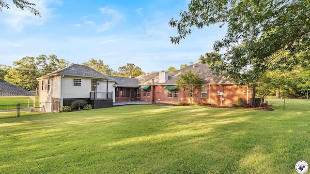 6616 Lakeridge Dr, Texarkana, TX 75503 - rear view of property with a fenced backyard, a deck, and brick siding