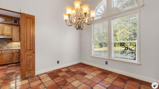 6616 Lakeridge Dr, Texarkana, TX 75503 - unfurnished dining area featuring a chandelier, plenty of natural light, and light tile patterned flooring