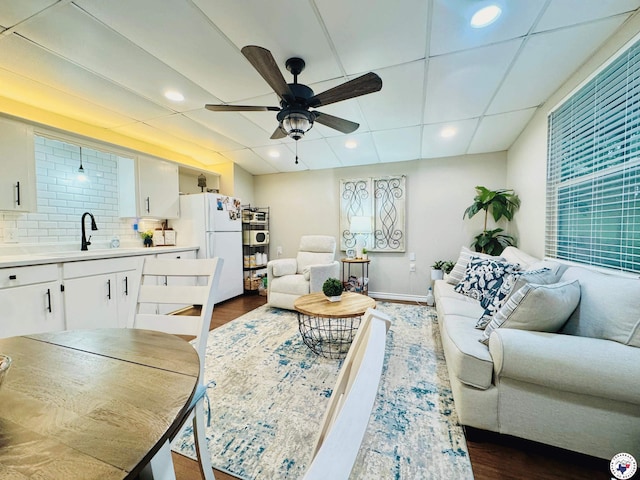 3705 Fm 2148 N, Texarkana, TX 75503 - living room featuring ceiling fan, dark wood-type flooring, and baseboards