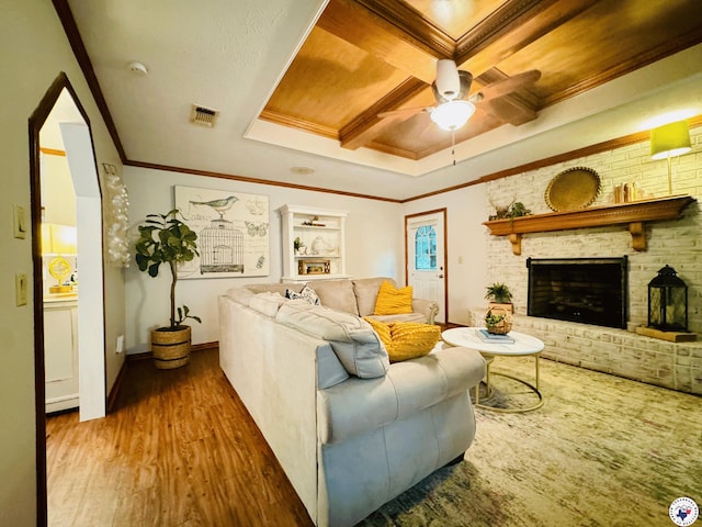 3705 Fm 2148 N, Texarkana, TX 75503 - living area with coffered ceiling, wood finished floors, ceiling fan, ornamental molding, and a brick fireplace