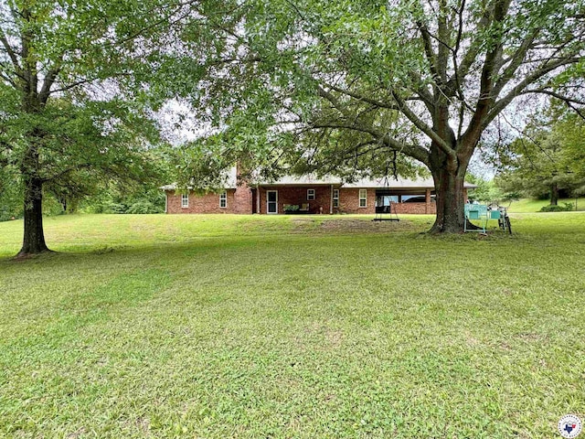 3705 Fm 2148 N, Texarkana, TX 75503 - view of grassy yard with a carport