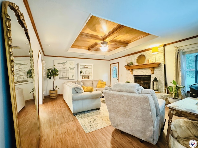 3705 Fm 2148 N, Texarkana, TX 75503 - living area with a ceiling fan, wood finished floors, crown molding, a brick fireplace, and a tray ceiling