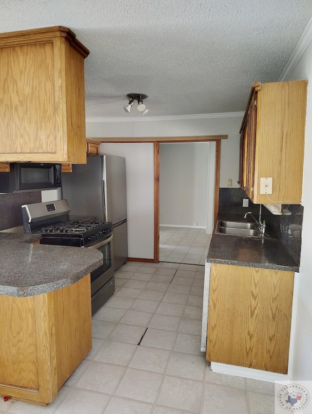 kitchen with sink, a textured ceiling, stainless steel range with gas stovetop, and crown molding