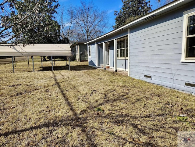 view of yard featuring a carport