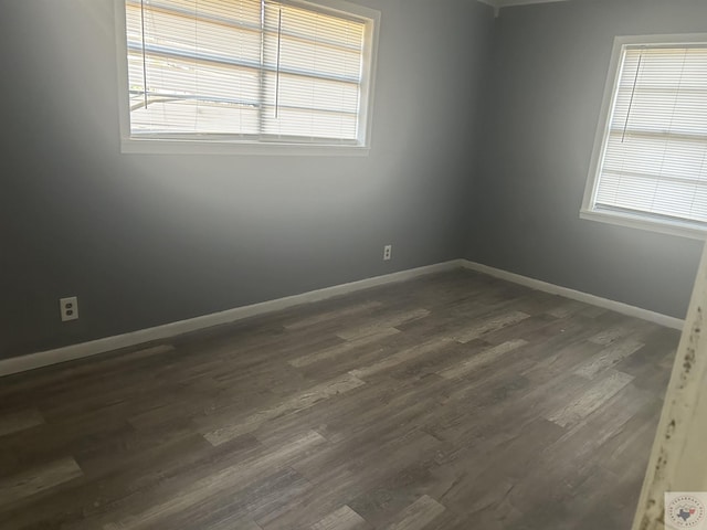 spare room featuring dark hardwood / wood-style flooring