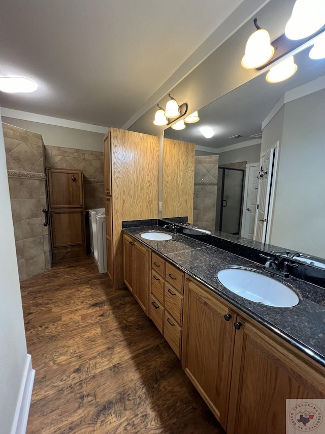 bathroom with vanity, walk in shower, and wood-type flooring