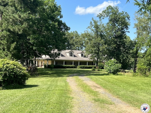 5922 Joey Ln, Texarkana, AR 71854 - new england style home featuring a front lawn