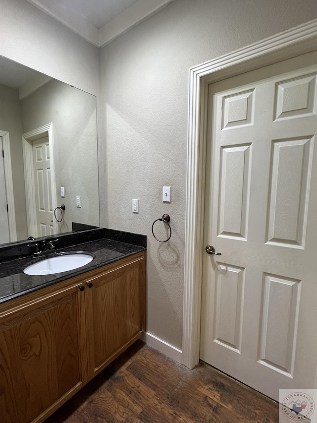 bathroom with wood-type flooring and vanity