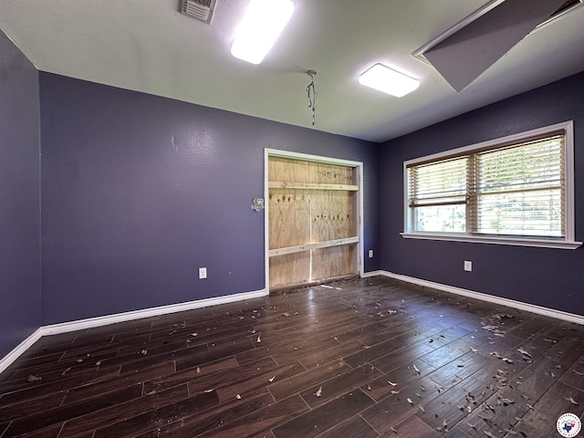5611 Larry Dr, Texarkana, TX 75503 - spare room with visible vents, baseboards, and wood finished floors