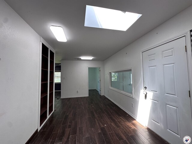 5611 Larry Dr, Texarkana, TX 75503 - corridor with a skylight, wood finished floors, and baseboards