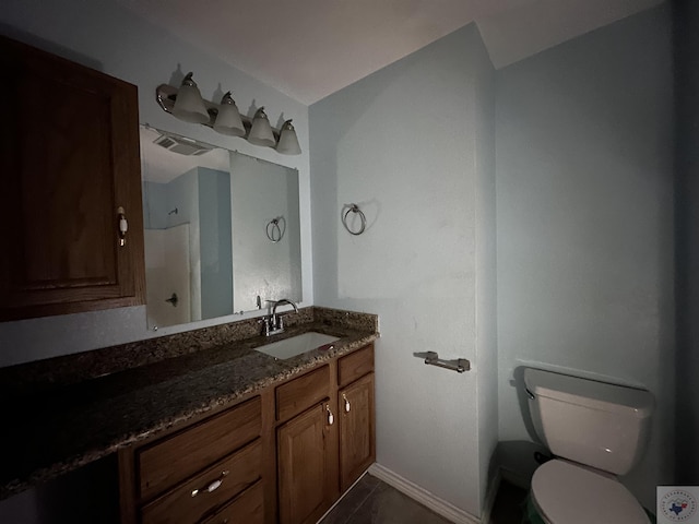 bathroom with vanity and toilet