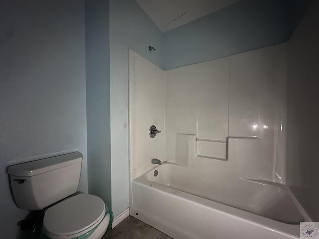 bathroom featuring shower / washtub combination and toilet