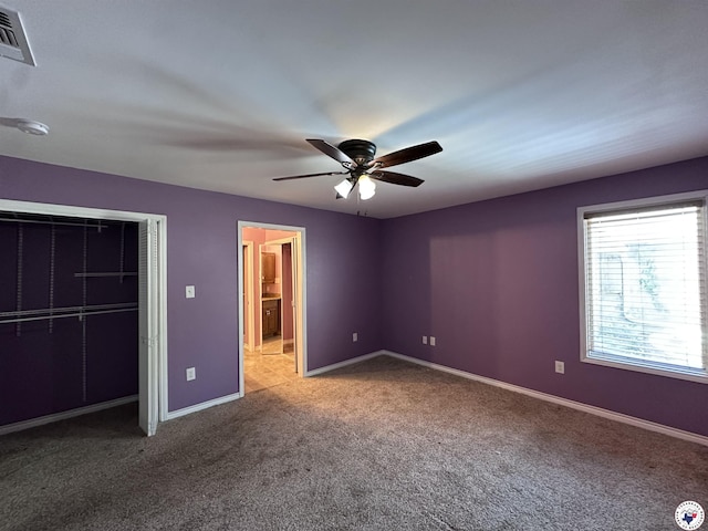 5611 Larry Dr, Texarkana, TX 75503 - unfurnished bedroom with visible vents, baseboards, a closet, a ceiling fan, and carpet flooring