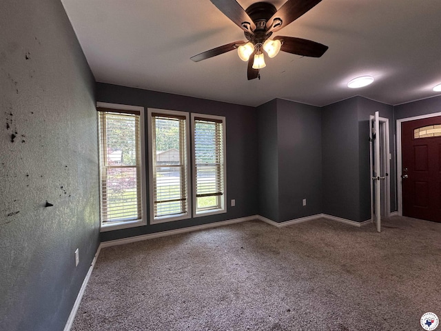 5611 Larry Dr, Texarkana, TX 75503 - carpeted spare room featuring a wealth of natural light, ceiling fan, and baseboards