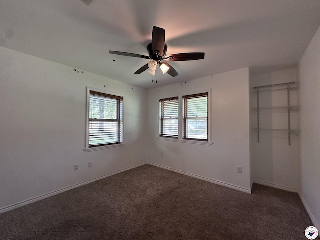 5611 Larry Dr, Texarkana, TX 75503 - unfurnished bedroom with baseboards, a ceiling fan, and carpet