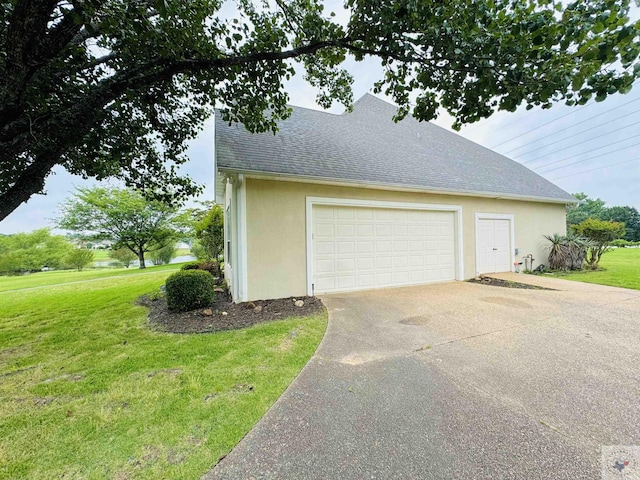 garage with a yard