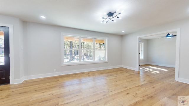 foyer entrance with light hardwood / wood-style floors