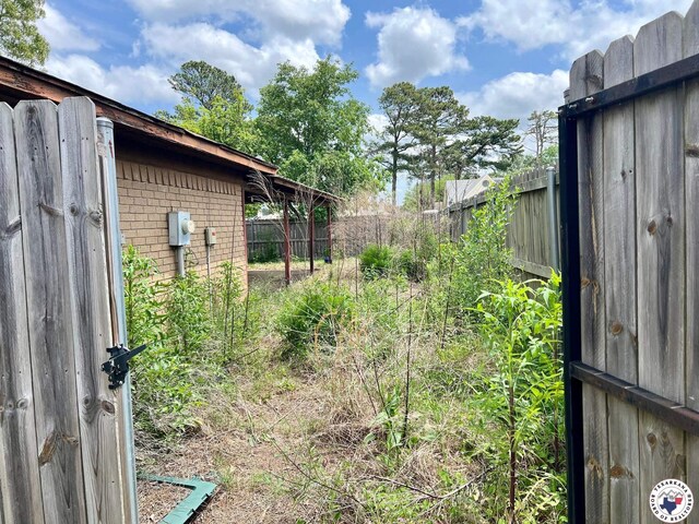 view of yard featuring fence