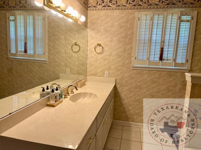 bathroom featuring tile patterned floors and vanity