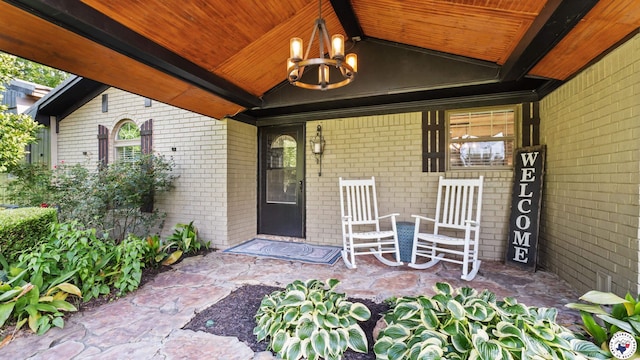 525 Longhorn Rd, Maud, TX 75567 - doorway to property with brick siding and covered porch