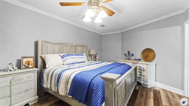 525 Longhorn Rd, Maud, TX 75567 - bedroom with dark wood-style flooring, crown molding, and ceiling fan
