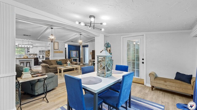 525 Longhorn Rd, Maud, TX 75567 - dining room with a chandelier, light wood-type flooring, and beamed ceiling
