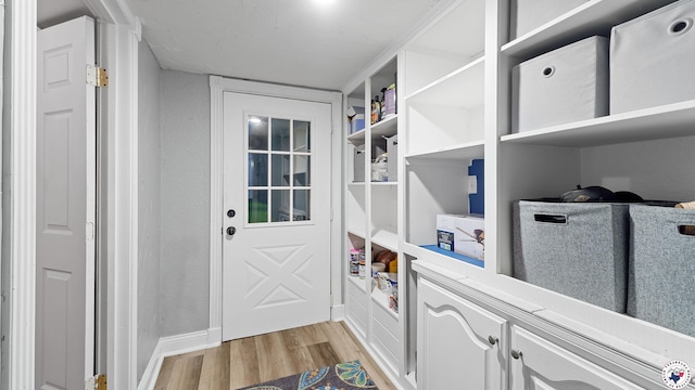 525 Longhorn Rd, Maud, TX 75567 - doorway with light wood finished floors and baseboards