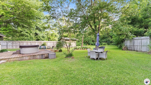 525 Longhorn Rd, Maud, TX 75567 - fenced backyard with a hot tub, a wooden deck, and a storage shed