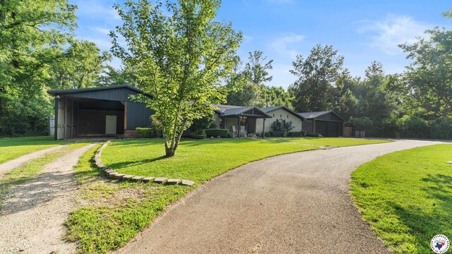 525 Longhorn Rd, Maud, TX 75567 - view of front of house featuring dirt driveway, a front yard, and a carport