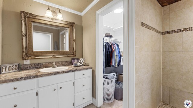 525 Longhorn Rd, Maud, TX 75567 - bathroom with vanity, a spacious closet, tiled shower, and ornamental molding