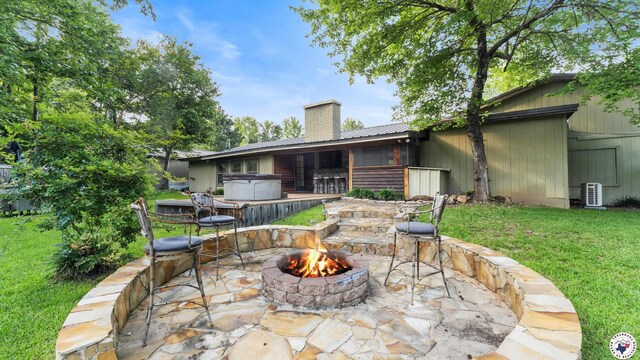 525 Longhorn Rd, Maud, TX 75567 - view of patio / terrace featuring a hot tub and an outdoor fire pit
