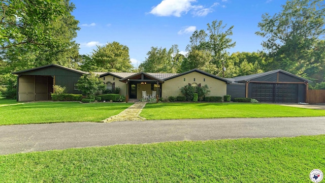 525 Longhorn Rd, Maud, TX 75567 - mid-century home with a front yard, driveway, and an attached garage