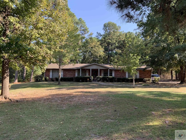 ranch-style house with a front lawn