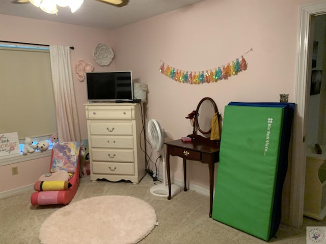 game room with ceiling fan and light colored carpet