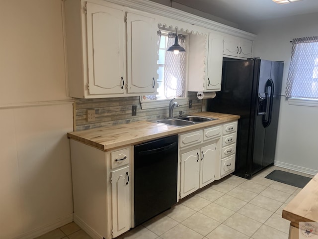 kitchen with black appliances, wood counters, white cabinetry, decorative backsplash, and light tile patterned flooring