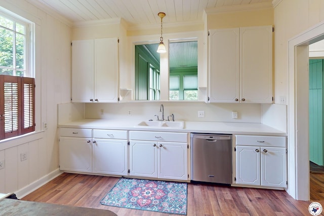 2300 Laurel St, Texarkana, AR 71854 - kitchen featuring stainless steel dishwasher, ornamental molding, plenty of natural light, white cabinetry, and light wood-style floors