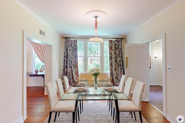 2300 Laurel St, Texarkana, AR 71854 - dining area with crown molding, plenty of natural light, and wood finished floors