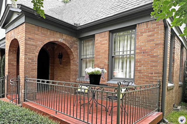 2300 Laurel St, Texarkana, AR 71854 - view of exterior entry with brick siding and a shingled roof