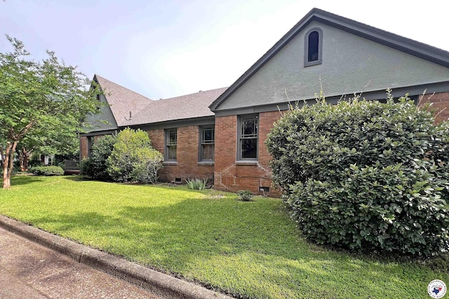 2300 Laurel St, Texarkana, AR 71854 - view of home's exterior with a yard, brick siding, crawl space, and a shingled roof