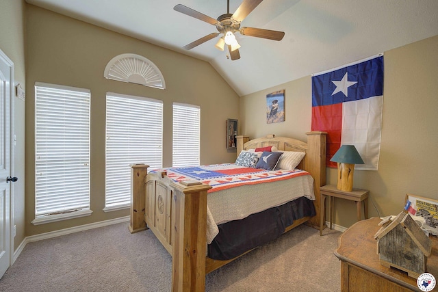 bedroom with ceiling fan, vaulted ceiling, baseboards, and carpet