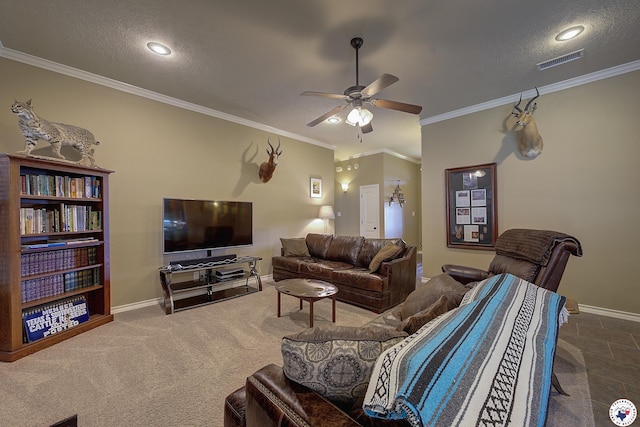 carpeted living room with ceiling fan, a textured ceiling, visible vents, crown molding, and baseboards