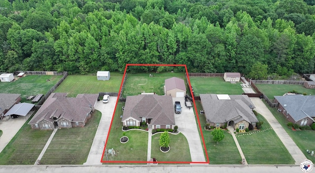 bird's eye view featuring a view of trees and a residential view
