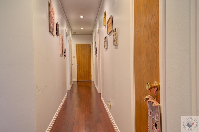 hallway with dark hardwood / wood-style floors