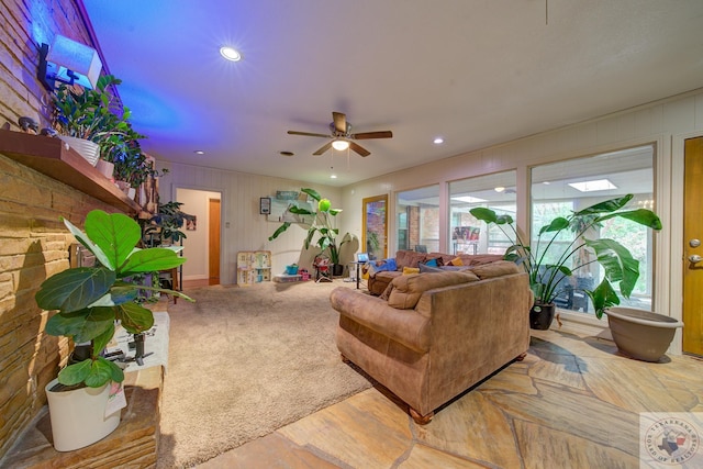 living room with ceiling fan and hardwood / wood-style floors