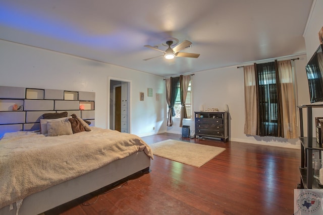 bedroom with ceiling fan and dark hardwood / wood-style flooring