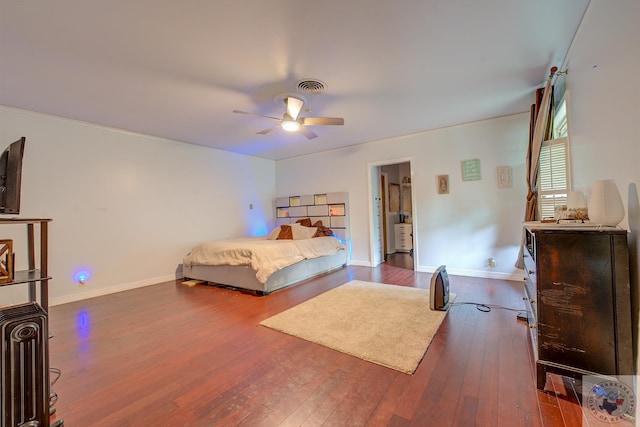 bedroom with ceiling fan and dark hardwood / wood-style floors