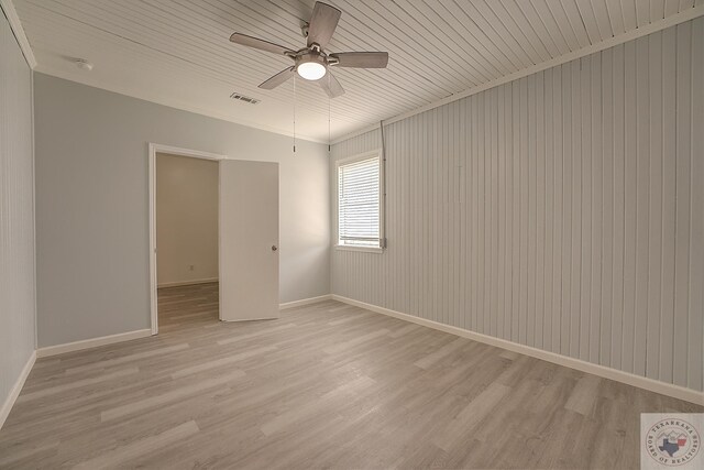 spare room featuring ceiling fan, light hardwood / wood-style flooring, and ornamental molding