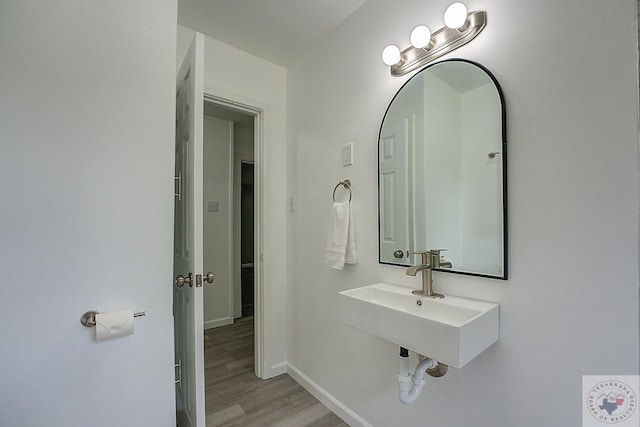 bathroom with sink and hardwood / wood-style floors