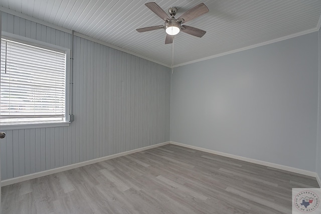 unfurnished room featuring ceiling fan, ornamental molding, and light wood-type flooring