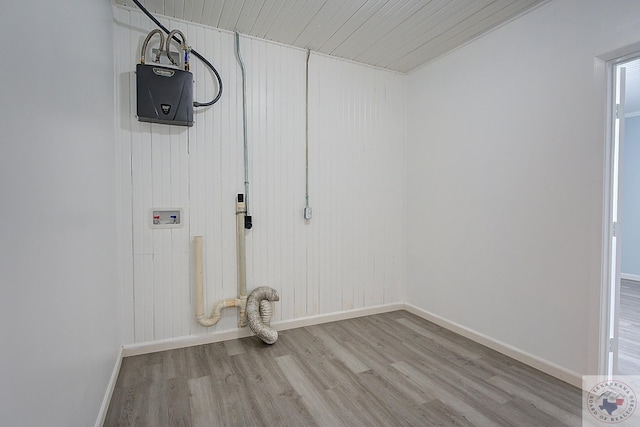 washroom featuring washer hookup and light hardwood / wood-style flooring